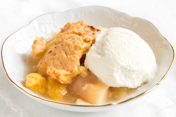istock peach cobbler with vanilla ice cream 686917200
