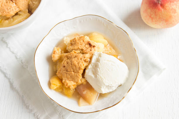 istock peach cobbler with vanilla ice cream 686917204