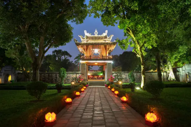 Photo of Khue Van Cac ( Stelae of Doctors ) in Temple of Literature ( Van Mieu ) at night. The temple hosts the 