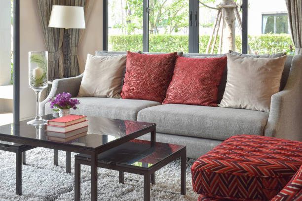 istock modern living room design with red pillows on sofa and decorative table lamp 686918060