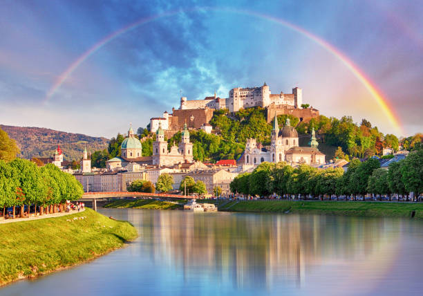 Austria, Rainbow over Salzburg castle Austria, Rainbow over Salzburg castle salzburger land stock pictures, royalty-free photos & images