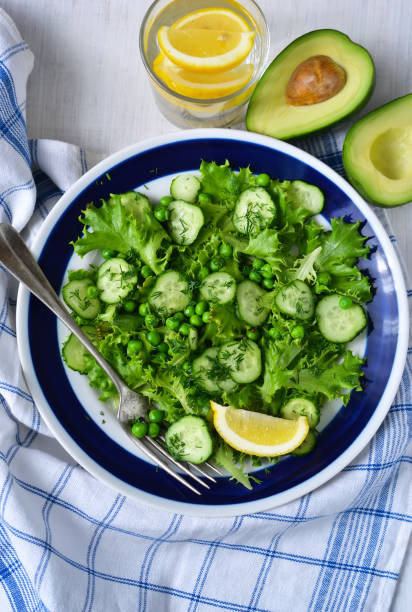 istock Green vegetarian salad with peas and cucumbers for lunch 686919446