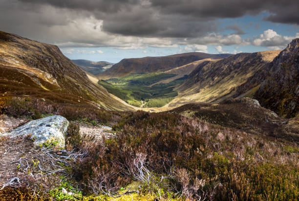 Cairn Broadlands Looking through the glen towards the Cairn Broadlands in Glen Doll. cairngorm mountains stock pictures, royalty-free photos & images