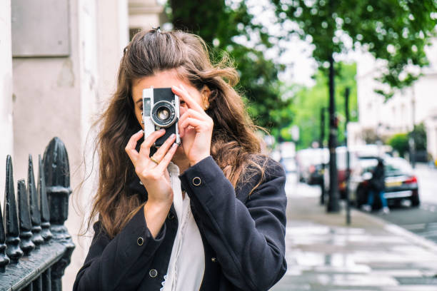 istock Young Woman With A Vintage Camera 686928566