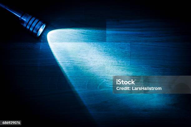 Flashlight Shining A Beam Of Light In Darkness Stock Photo - Download Image Now - Flashlight, Blackout, Dark