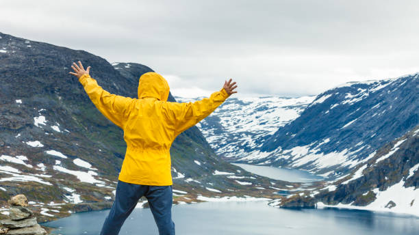 istock Tourist man standing by Djupvatnet lake, Norway 686935886
