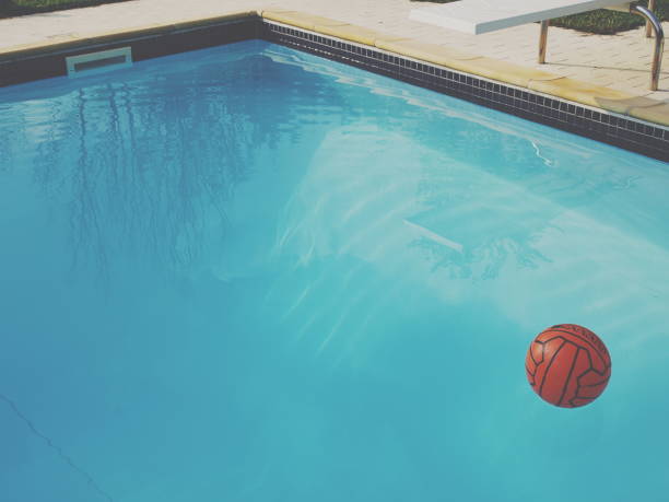 istock swimming pool with orange ballon 686939126