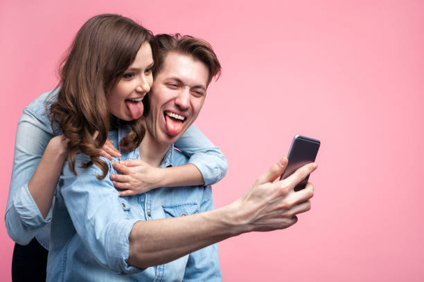 istock Cheerful couple taking selfie 686946490