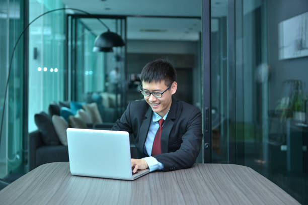 istock Asian Businessman using smartphone in a conference room 686947054