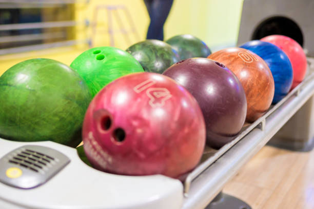 istock Closeup of Plenty Bowling Balls In One Line On Machine. 686947720