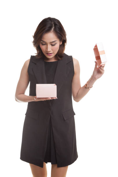 istock Young Asian woman open a gift box. 686950270