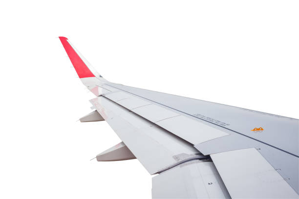 istock Wing of airplane flying above clouds blue sky background 686957110
