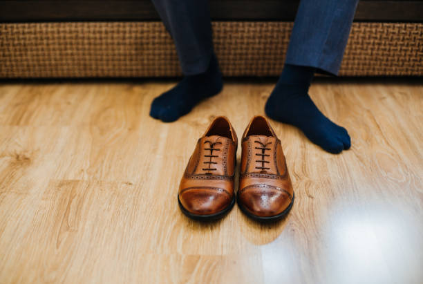 istock Business man dressing up with classic, elegant shoes. 686957666