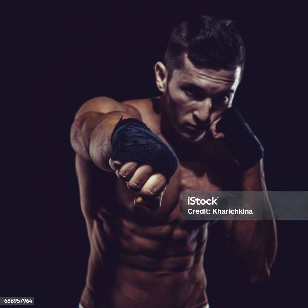 Mma Fighter Preparing Bandages For Training Dark Background Stock Photo - Download Image Now