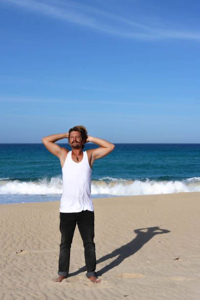 istock Men enjoying the sun on the beach 686961106