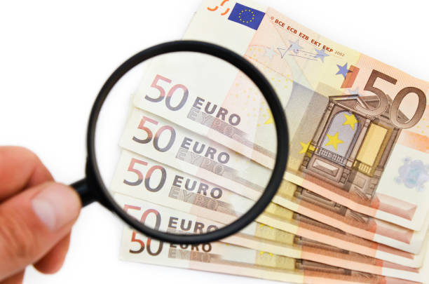 istock Euro notes under magnifying glass. Economics etc. 686961254