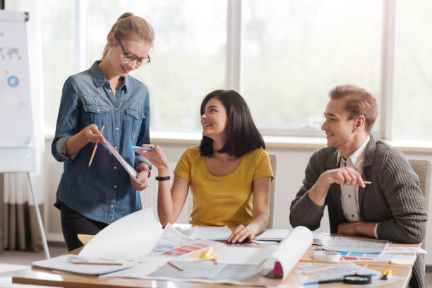 istock Positive delighted woman pointing at the sketch 686961722