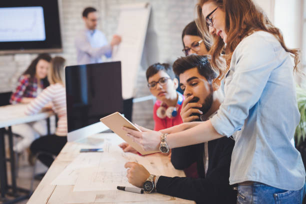 istock Creative young business people and architects working in office 686965248