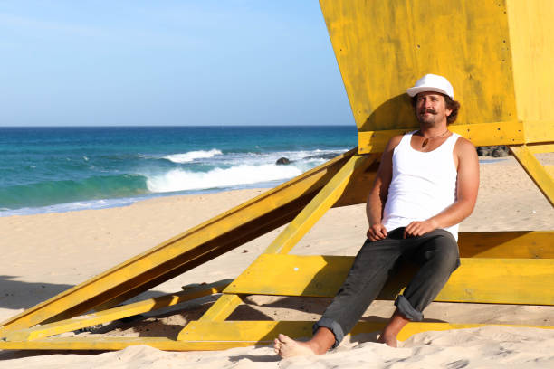 istock Men enjoying the sun on the beach 686965298