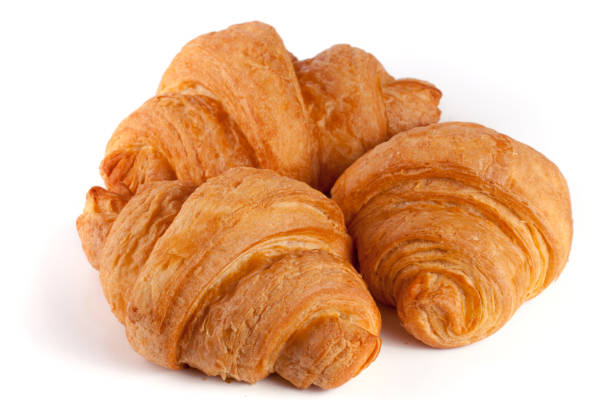 istock three croissant isolated on white background closeup 686969698