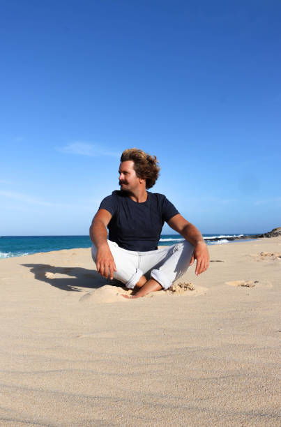 istock Men enjoying the sun on the beach 686969832
