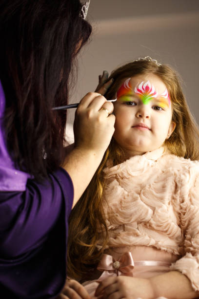 istock Girl getting her face painted 686975060