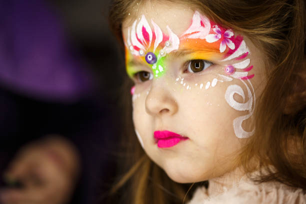 istock Cute, little girl with her face painted 686975110