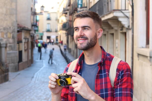 istock Handsome man holding a vintage camera 686975326
