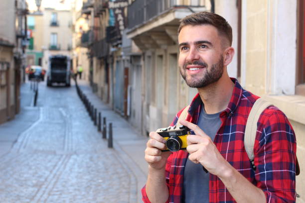 istock Handsome traveler about to take a picture 686975616