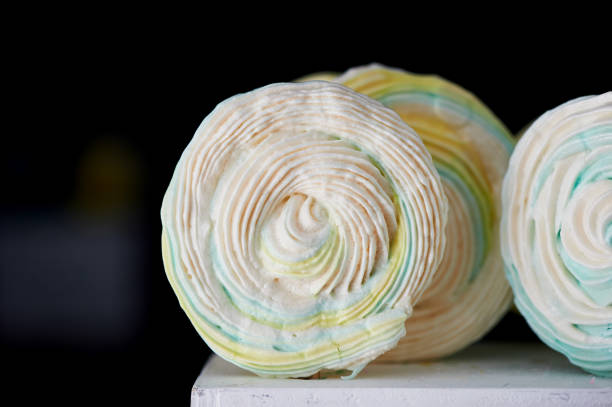 istock Meringue on a stick , round shape. Spiral. Light and delicious, air 686975632