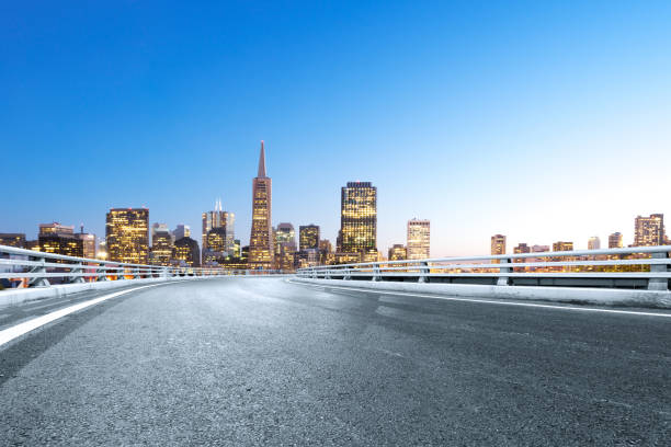 istock empty road with modern city at twilight 686975854