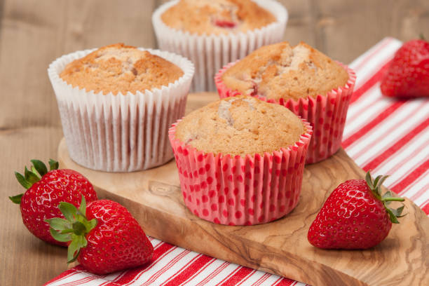 istock Homebaked Strawberry Cupcakes In Paper Cases. Strawberries. Olive Tree Board. 686982920