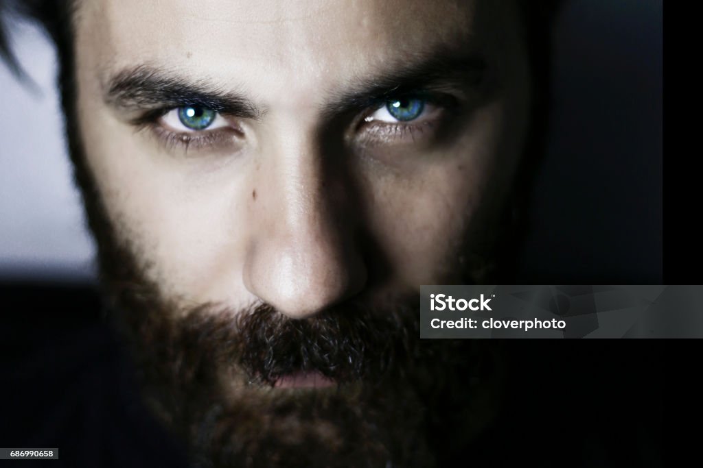 Bearded man portrait close-up blue eyes İstanbul, Turkey - February 23. 2017:close up face, blue eyes, strong man, bearded man Men Stock Photo