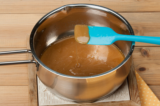 Caramel Cooking Process. Melted Toffee In Sauce Pan