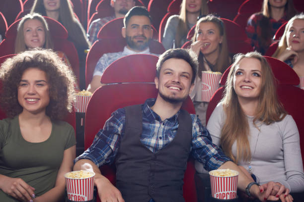 istock Three smiling best friends spending free time at cinema. 686999496