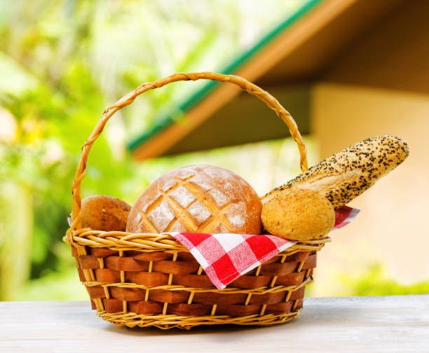 istock Fresh bread in the basket on natural background 686999700