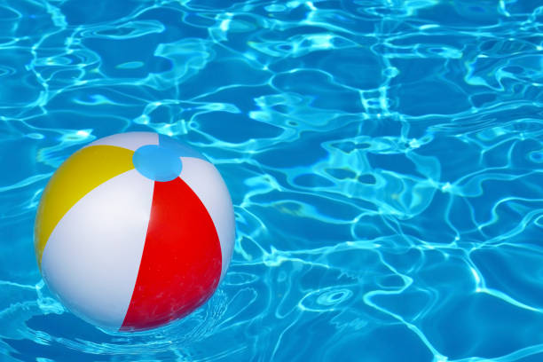 istock Colorful inflatable ball floating in swimming pool 686999908