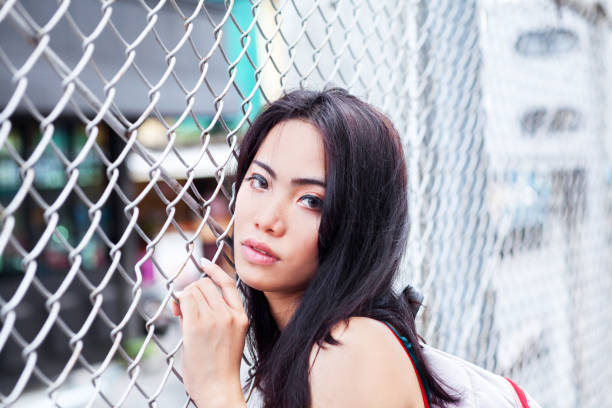 istock Filipina transgender leaning at fence 687000094