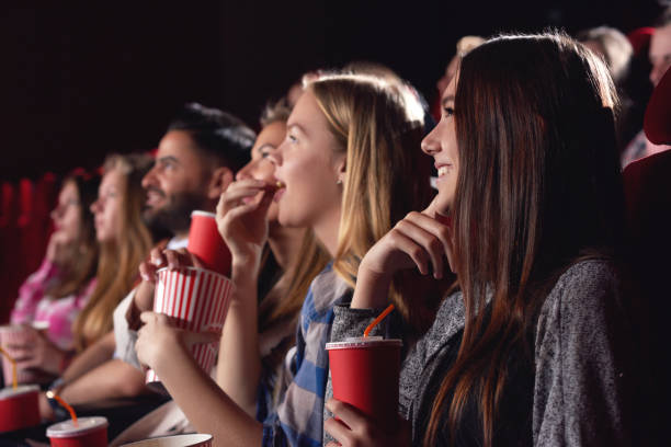 Best Friends Watching Funny Film At Cinema Stock Photo - Download Image Now  - Movie, Cola, Film Industry - iStock