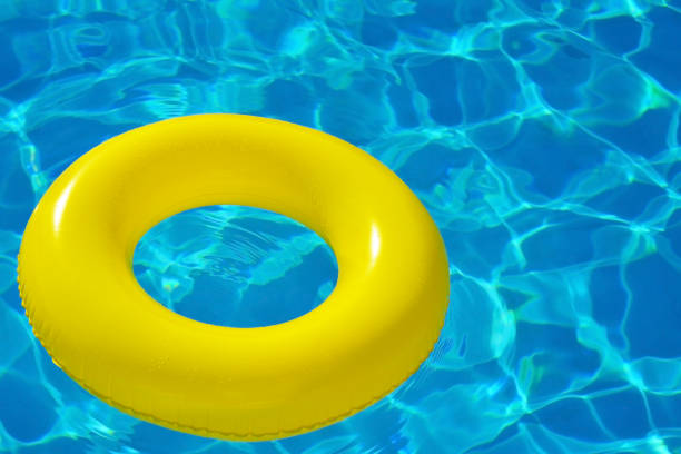 istock Colorful inflatable tube floating in swimming pool 687000368