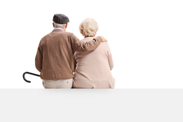 Rear view shot of senior couple sitting on panel