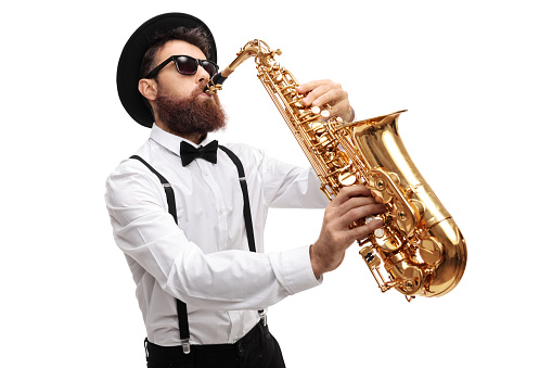Bearded man playing a saxophone isolated on white background
