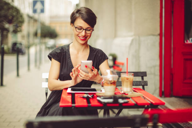 istock Businesswoman having breakfast in a coffee shop 687014458
