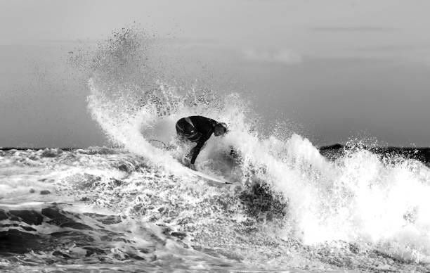 This is a photo of a surfer's feet while surfing on the wave.