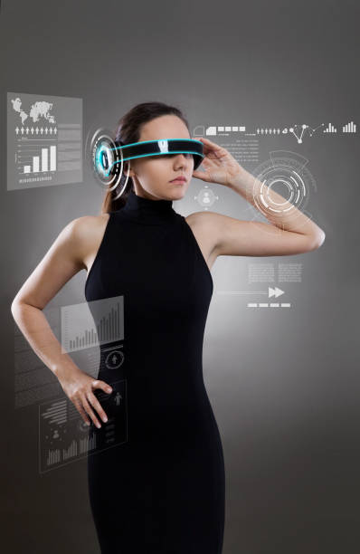 Beautiful woman with futuristic glasses Young woman with smart-glasses front of virtual future interface smart glasses eyewear stock pictures, royalty-free photos & images