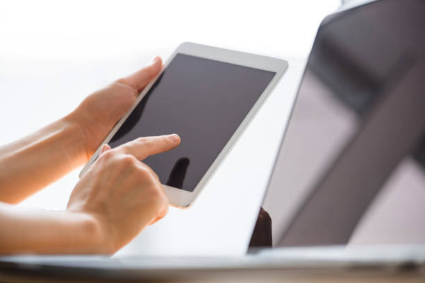 istock Finger pointing to tablet screen, using gadget for search, detail close up 687023526