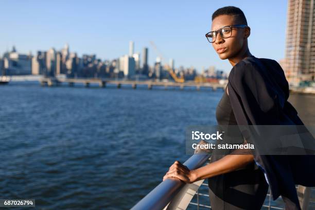 Young African Fashionable Businesswoman Working Outdoor New York Manhattan View Skyline Stock Photo - Download Image Now