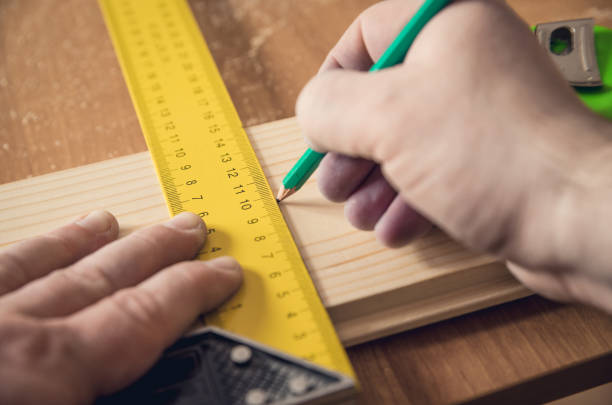 istock Measuring the wooden board 687027486