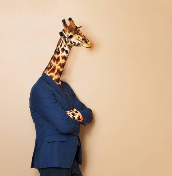 istock Giraffe headed businessman with his arms folded 687033976