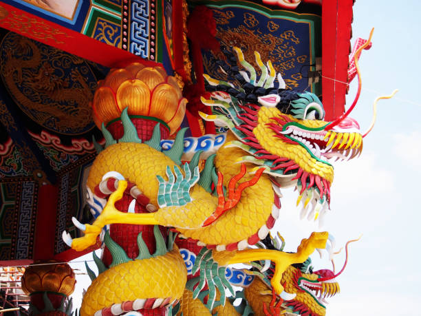 istock Chinese dragon wrapped around red pole 687034754
